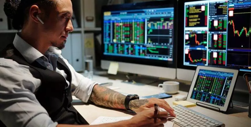 Broker reviewing trades